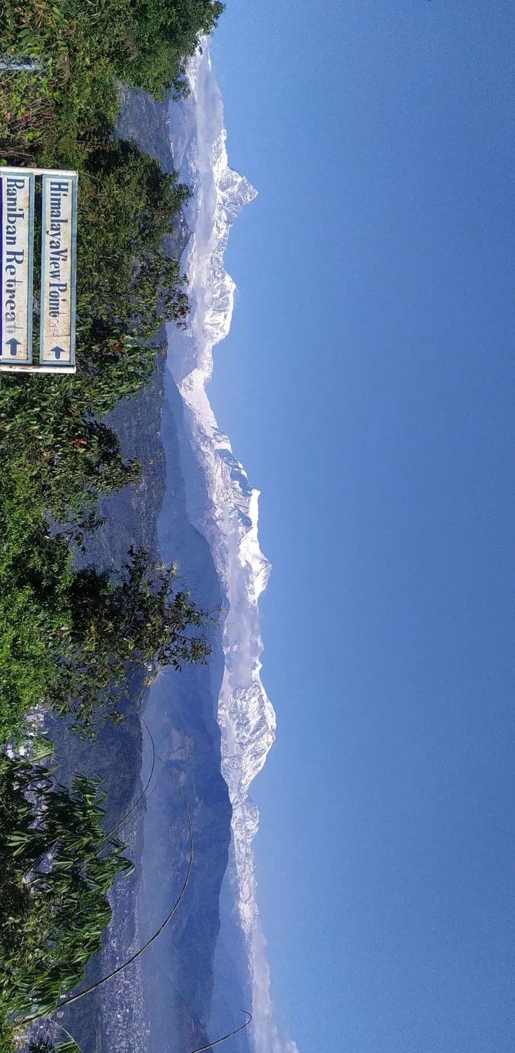 Morning mist rising over the Himalayan valley from the homestay terrace